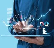 image of a tablet with graphs and charts above it that someone is holding.