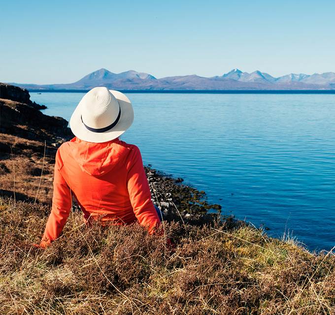 Person staring out at a body of water