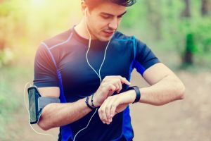 Runner in the park using smart watch