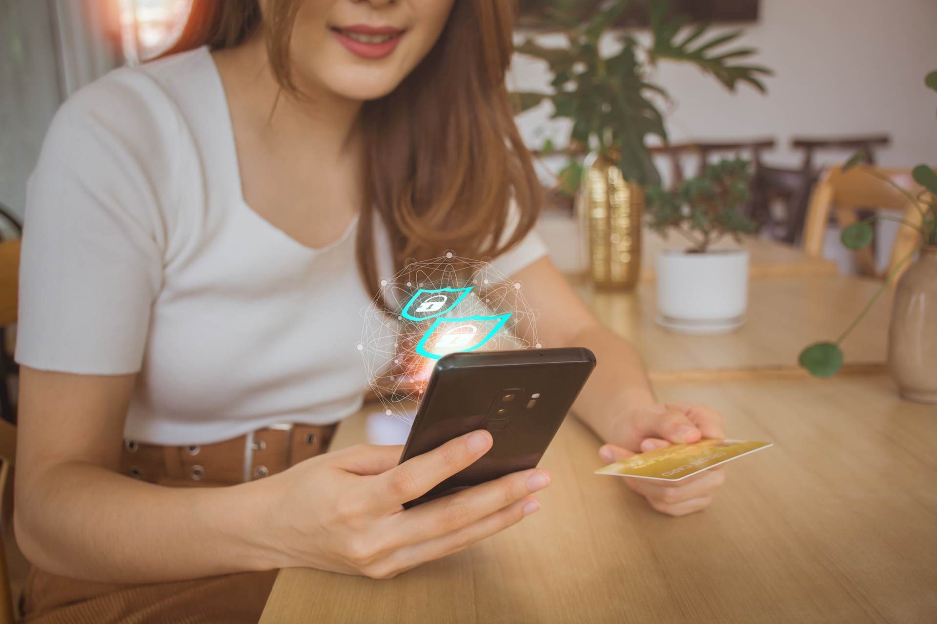 Young girl online shopping with the padlock showing from the website