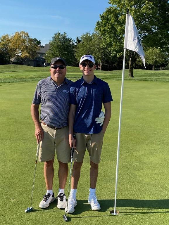 Curt Roselle on the golf course with his father