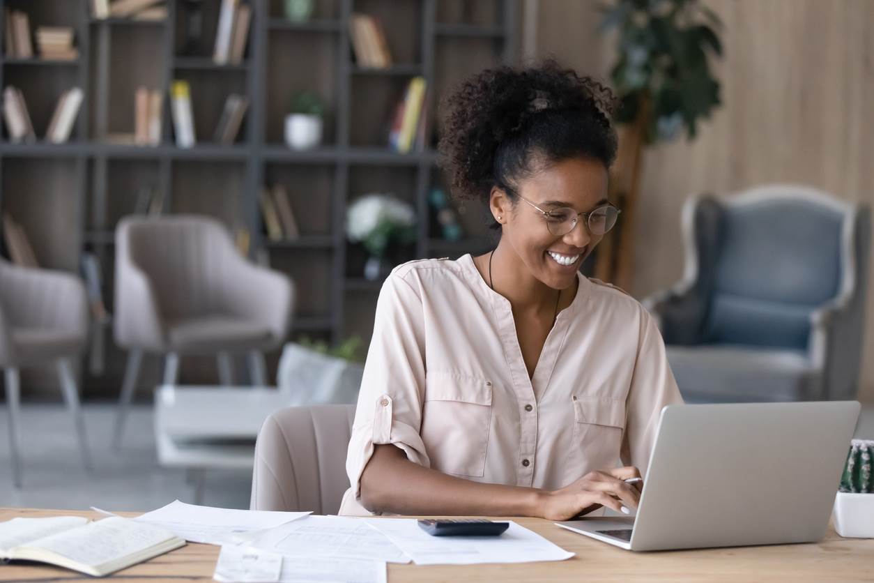 African American woman balances her budget