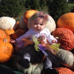 girl with pumpkins