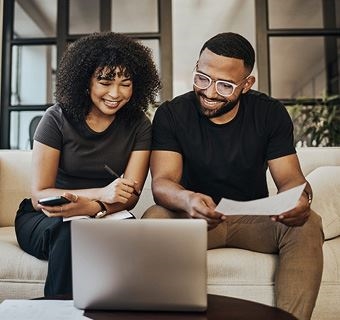 Image of couple looking at laptop together