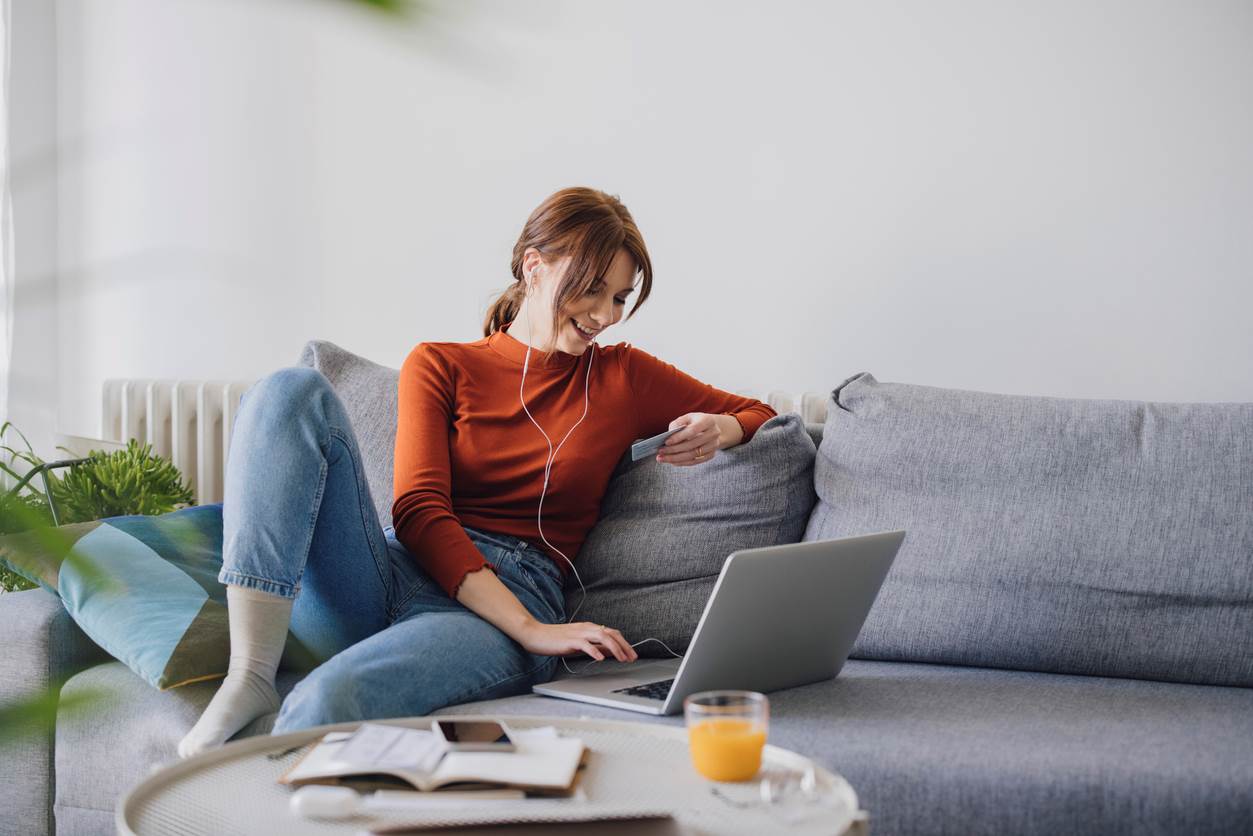 woman on couch with laptop