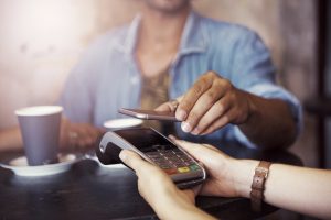Cropped shot of a customer paying for coffee with a smartphone at a cafehttp://195.154.178.81/DATA/i_collage/pu/shoots/806208.jpg