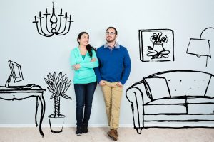 Mid adult Hispanic couple daydream in their new home