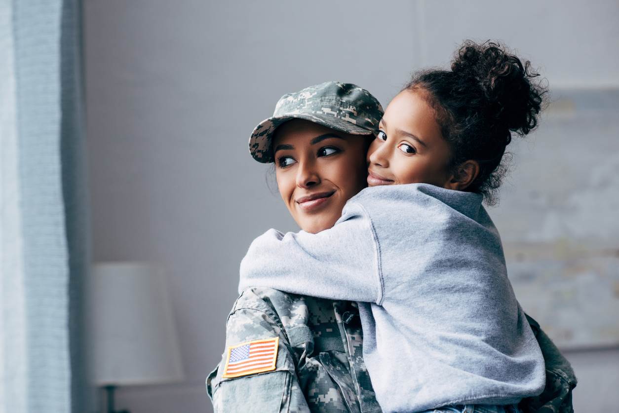 Veteran mother holding her daughter