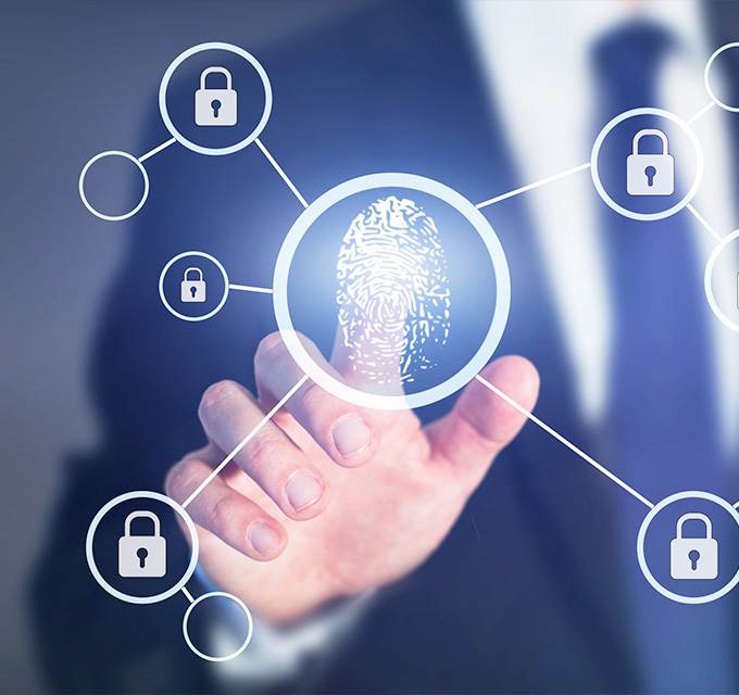A man in a business suit touching a fingerprint icon