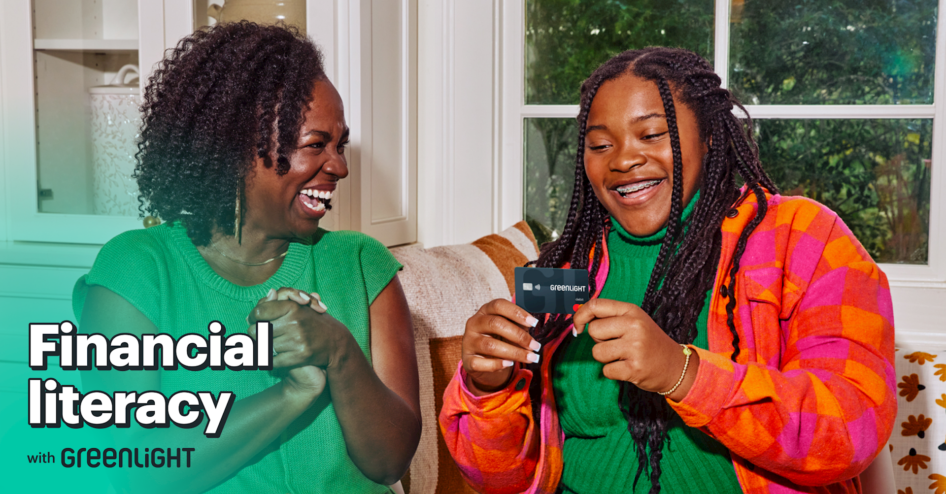 Mother and daughter show excitement over receiving a Greenlight card